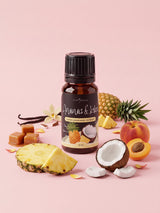 Olejek zapachowy do świec Ananas i Kokos w butelce 10 ml otoczonej ananasem, połówką kokosa, brzoskwinią, morelą, karmelem i laskami wanilii