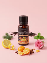 Olejek zapachowy do świec Orange Spices w butelce 10 ml otoczonej pomarańczą, laskami cynamonu, goździkami, cytryną, miętą i laskami wanilii